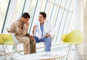 Medical provider talking with military man
