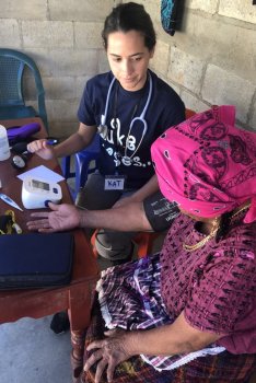 Student providing care to patient in Guatemala
