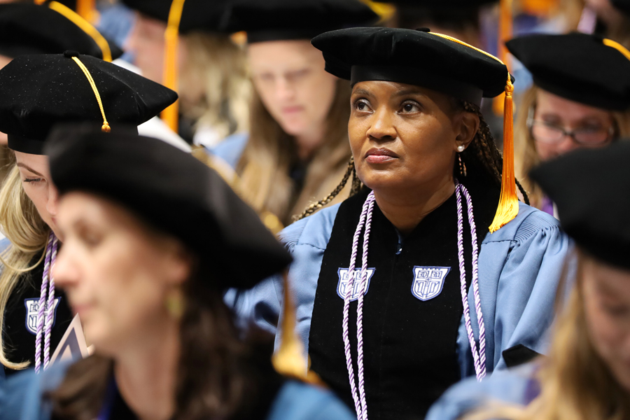 School of Nursing Graduate in regalia at graduation