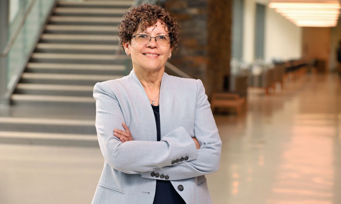 Associate Clinical Professor Dr. Iris Padilla standing in the lobby of the IPEC Building on Duke Campus