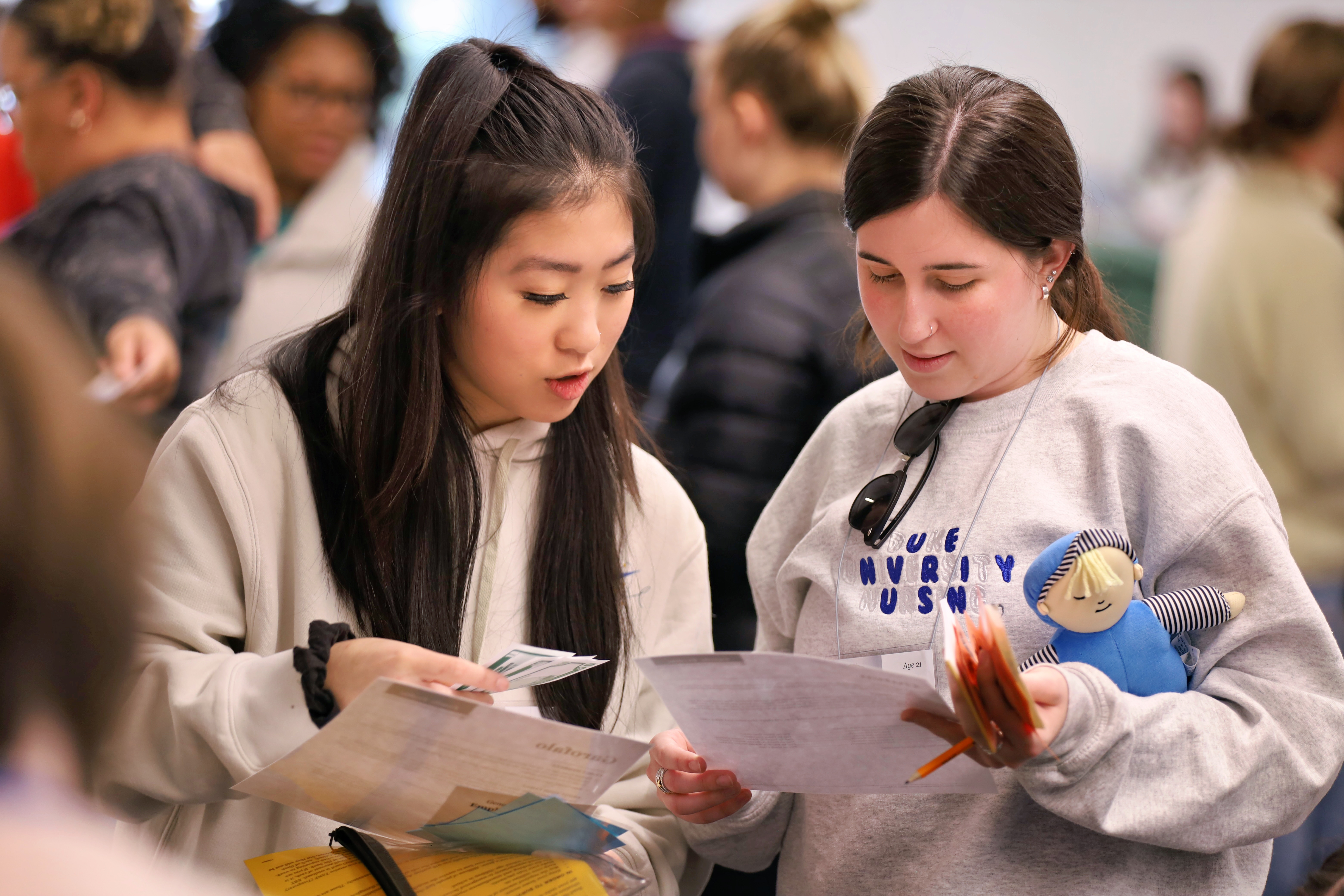 Two School of Nursing Students reviewing information together