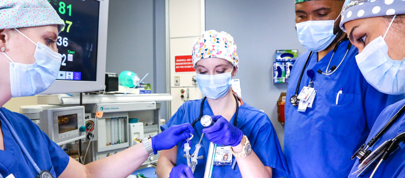 CRNA Nurse Anesthesia Students in a simulated operating room environment.