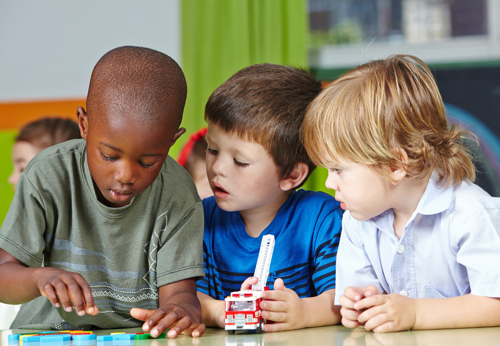 Three young boys playing together