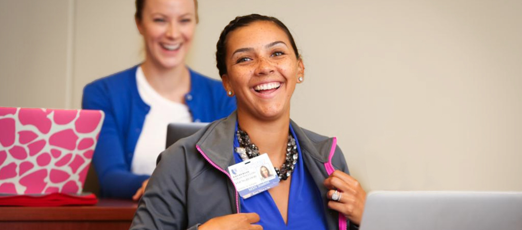 Nursing student smiling while taking off backpack