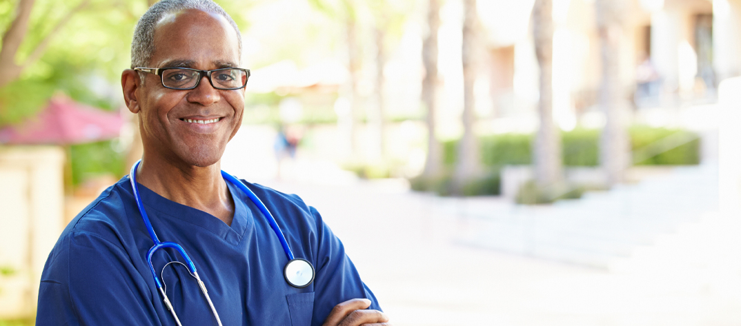 Male nurse smiling at the camera