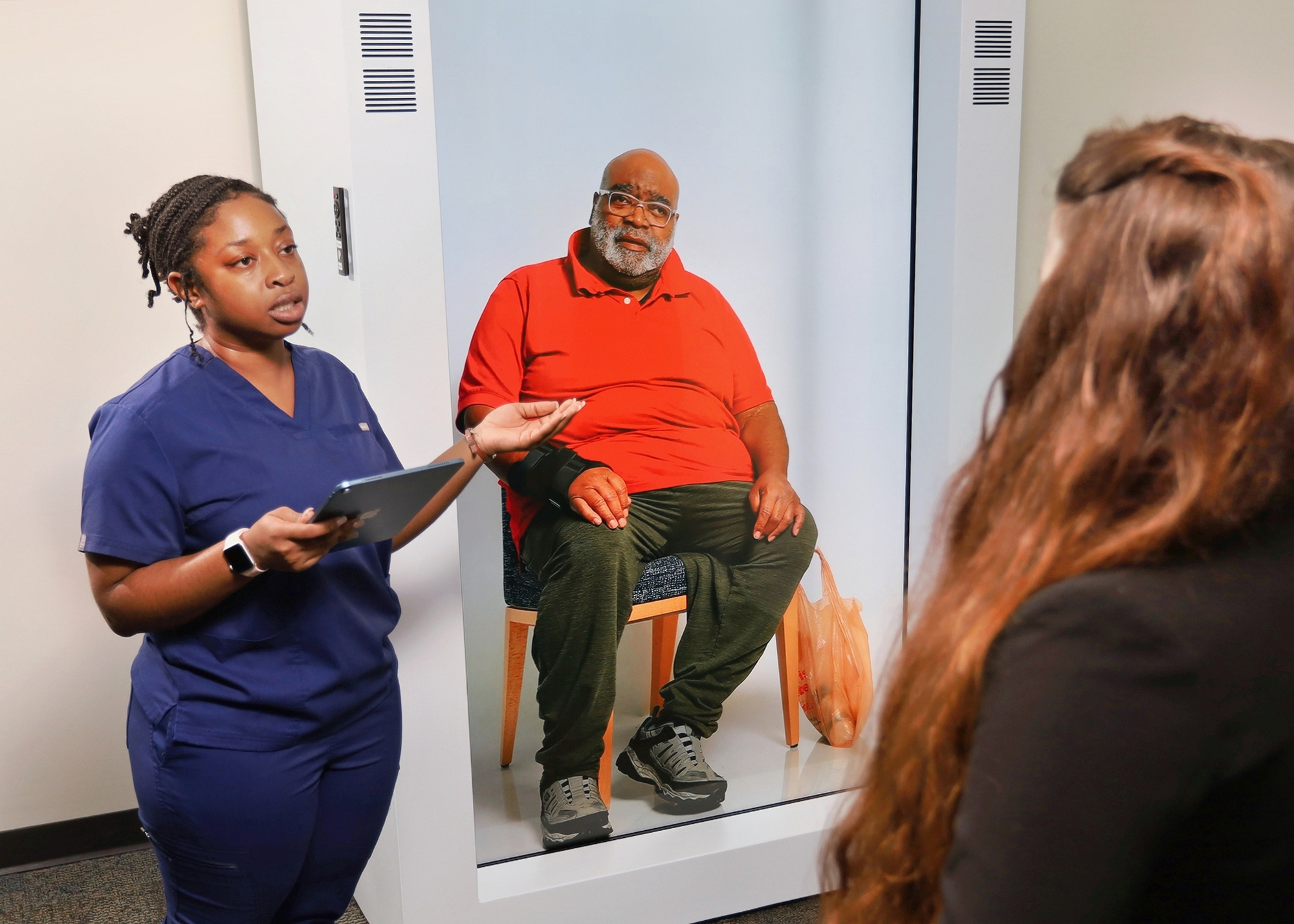 Student demonstrates the School of Nursing's hologram machine