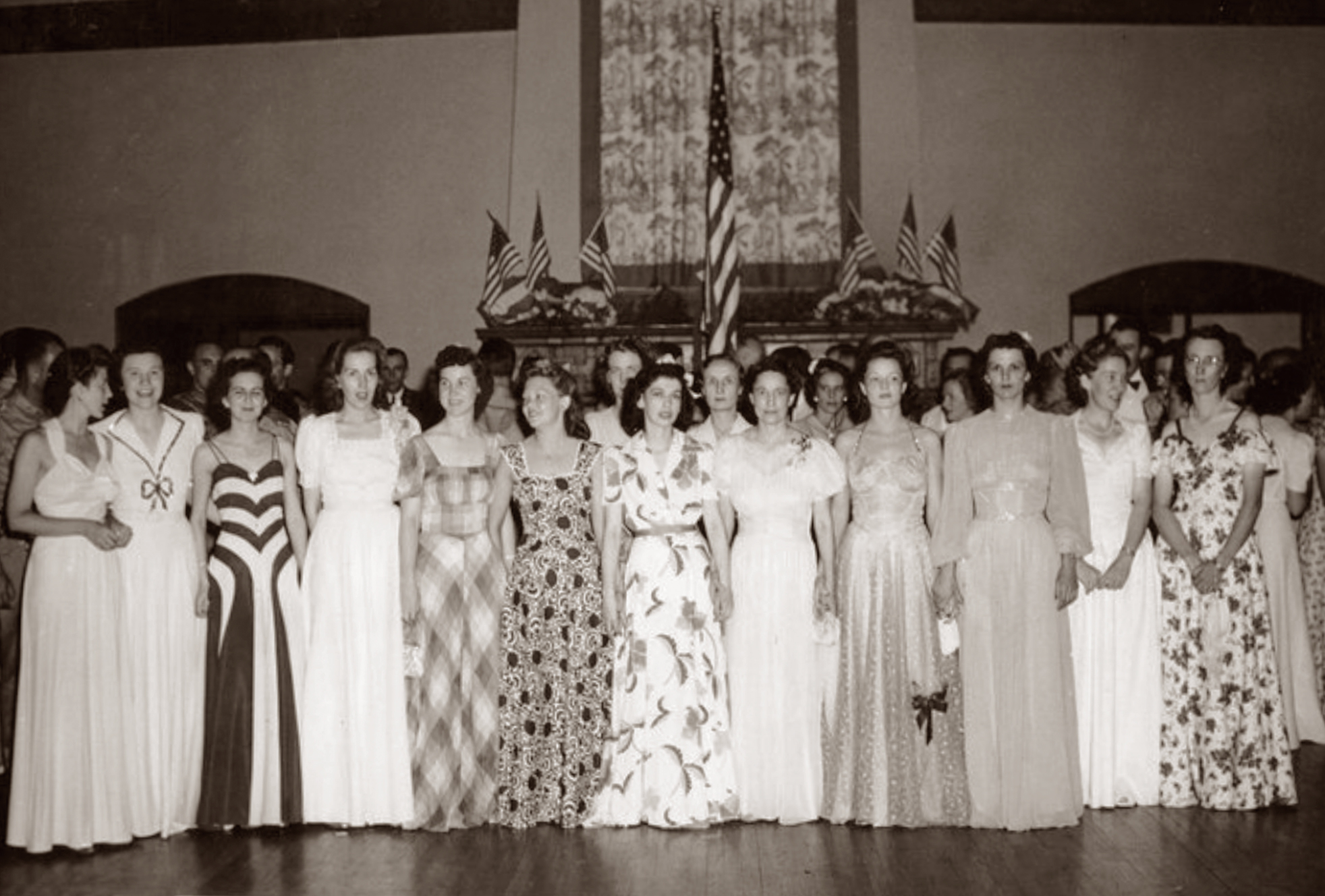 Nurses at a flag presentation at a party for members of the 65th General Hospital