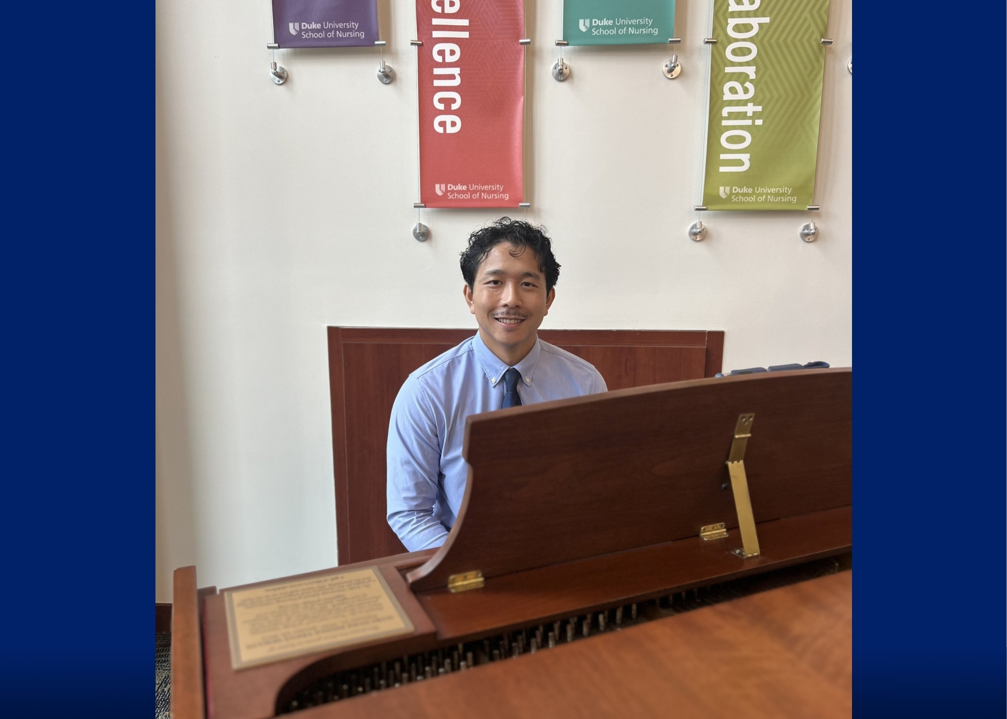 ABSN Student Edward Mandolang sitting at a piano