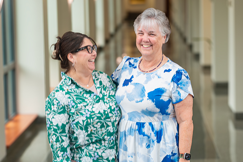Vicki Rennecker-Nakayoshi and Dr. Midge Bowers laughing
