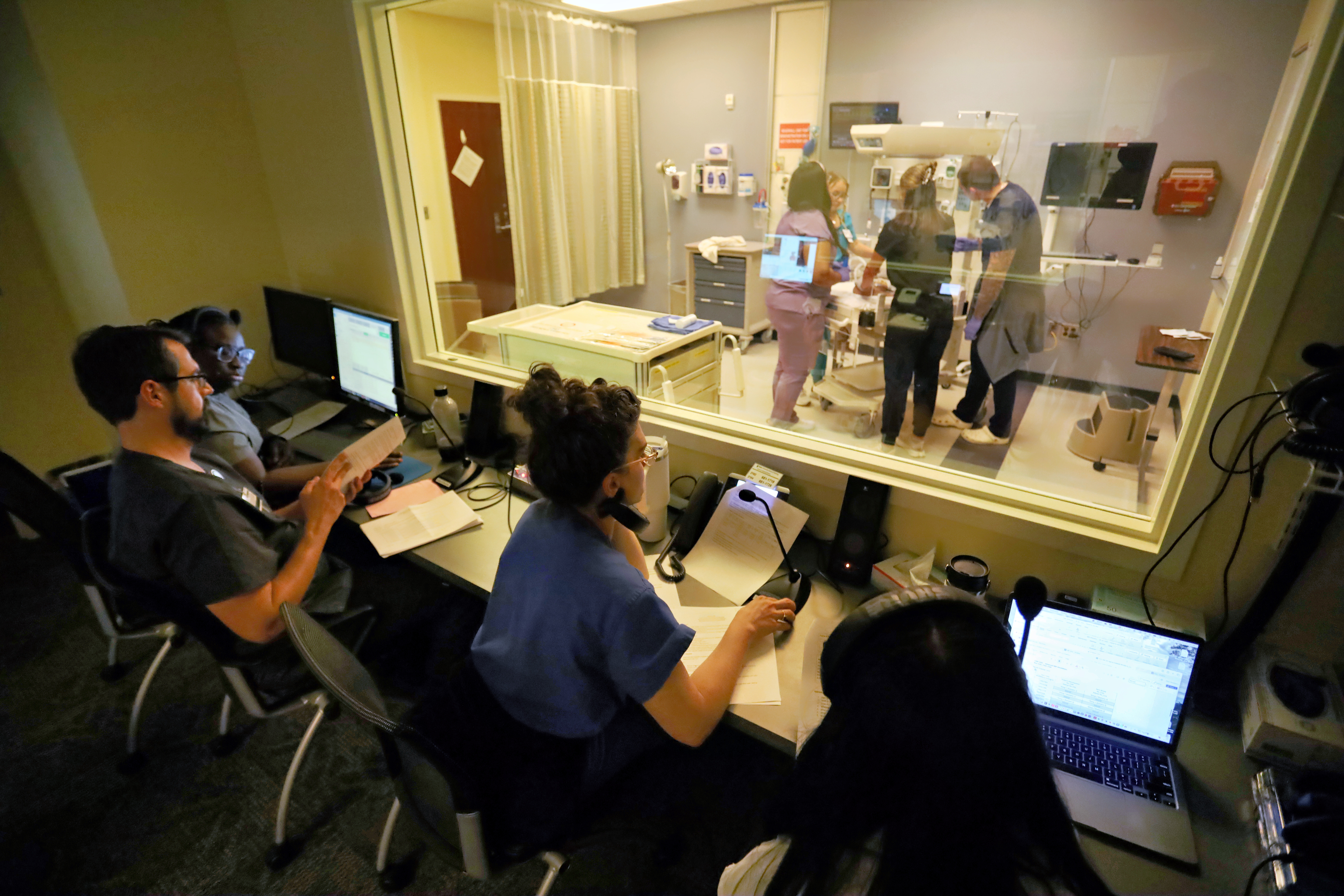 Duke nursing faculty observe a simulation