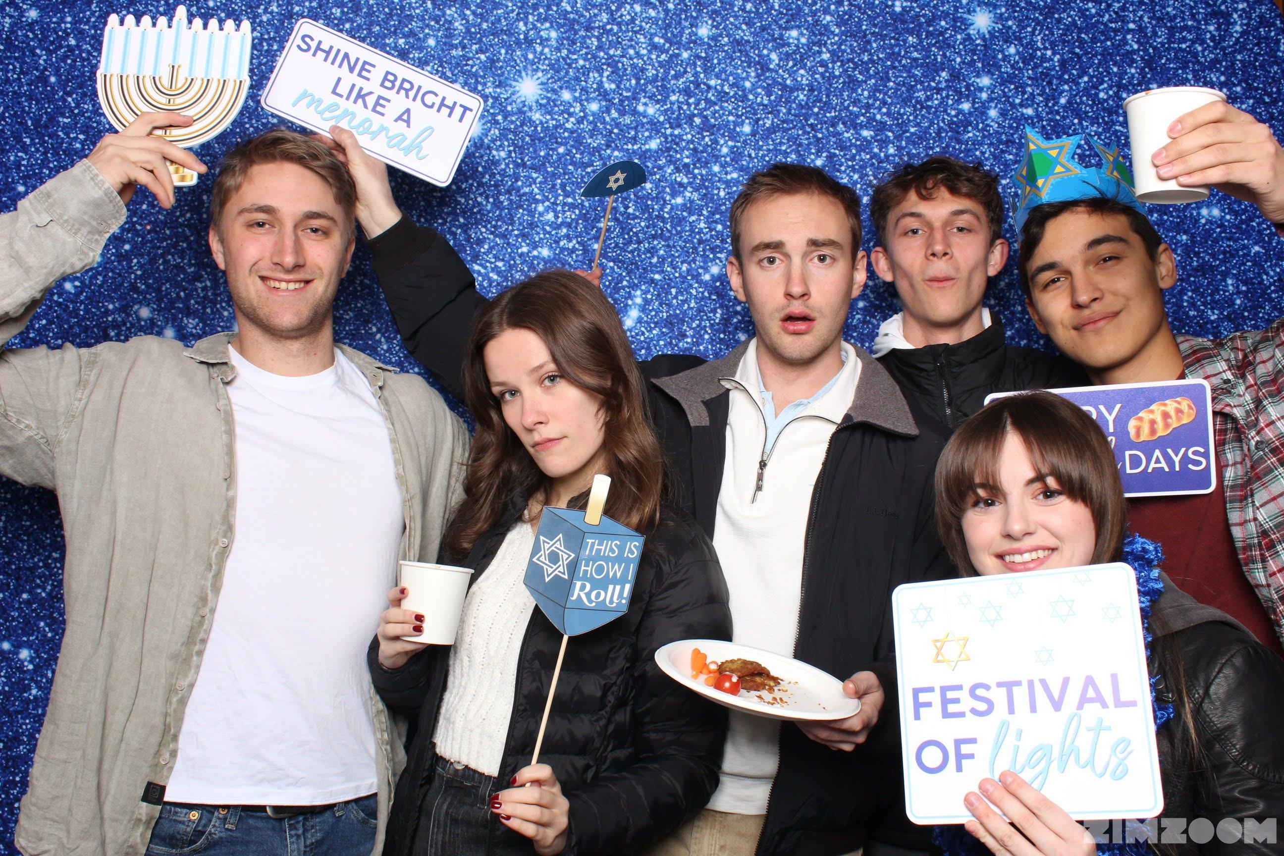 students posing in photo booth