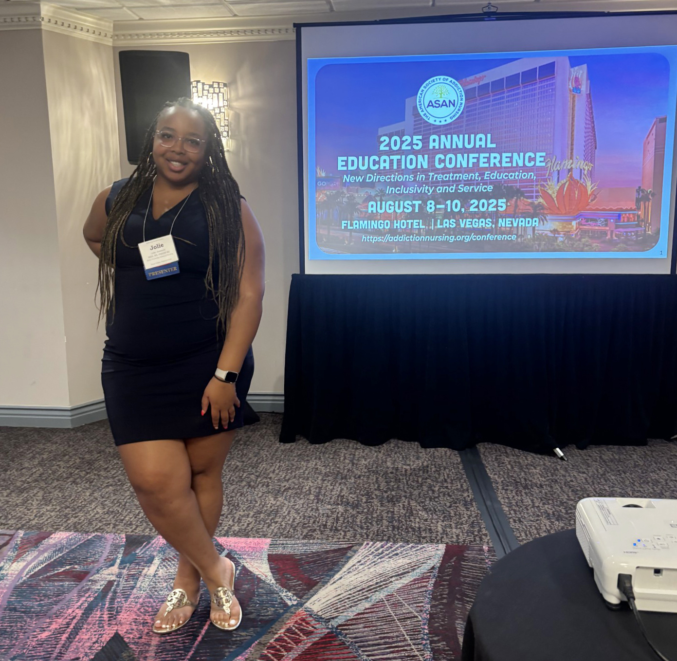 A student giving a presentation in a conference room.