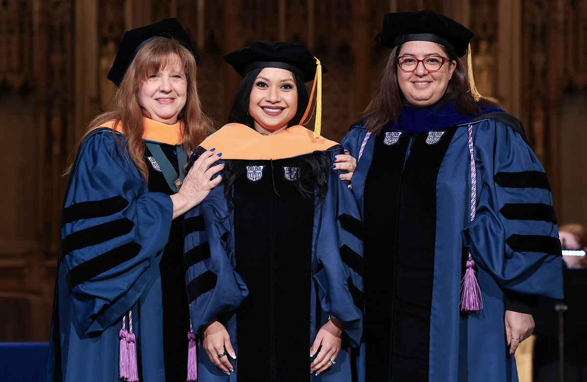 Sahara Aguilar at her graduation flanked by Dr. Mary Lou Affronti and Dr. Mariam Kaye