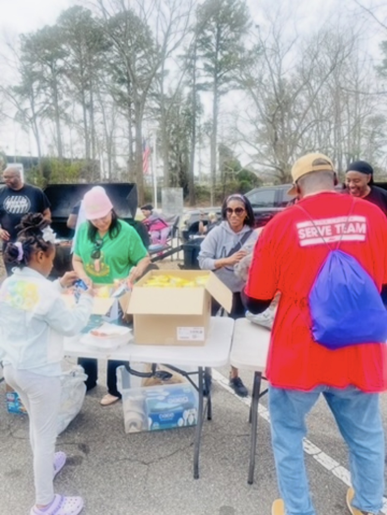 Lydia Nichols and others at a table set up for a community event