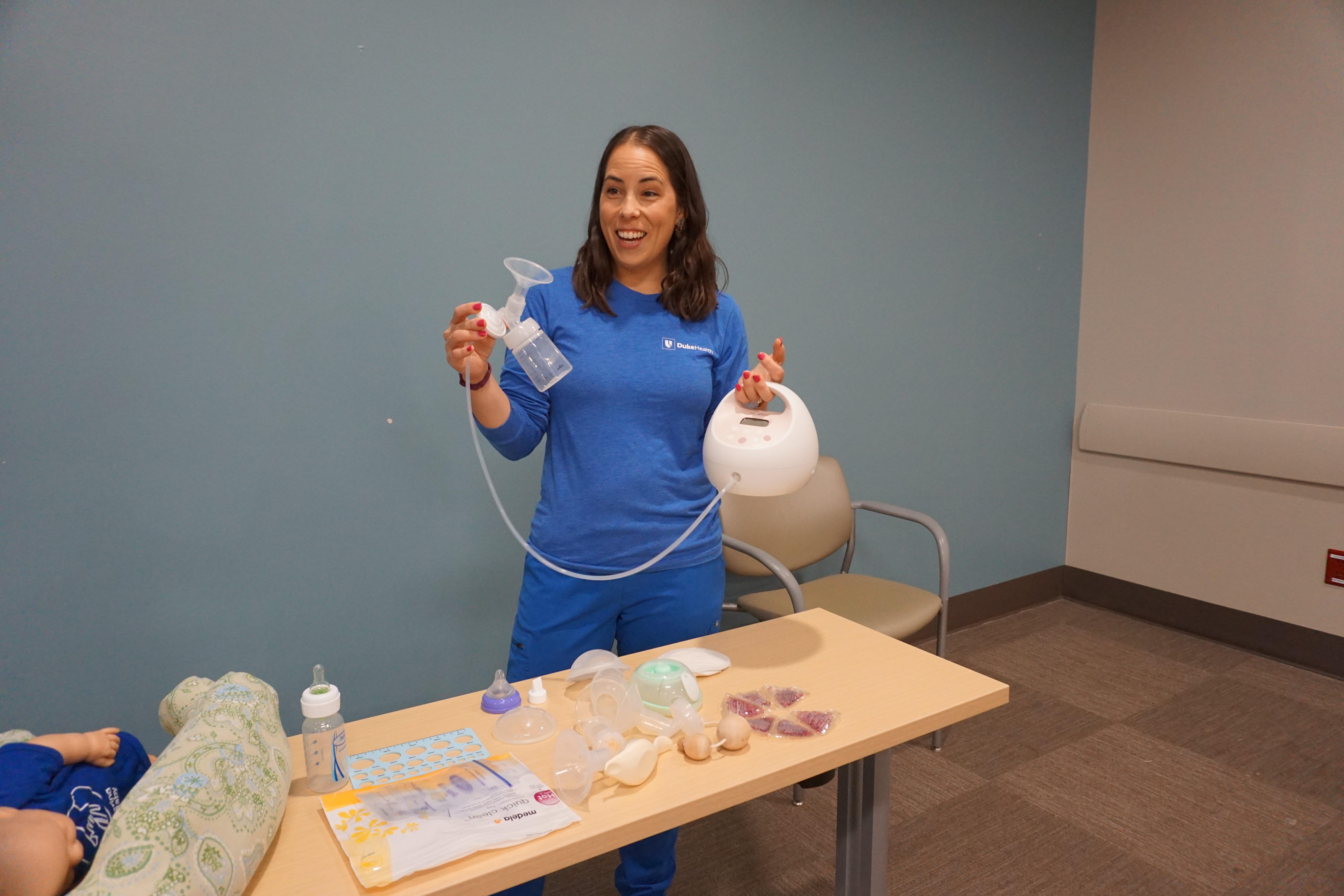 Lawdley holding a breast pump