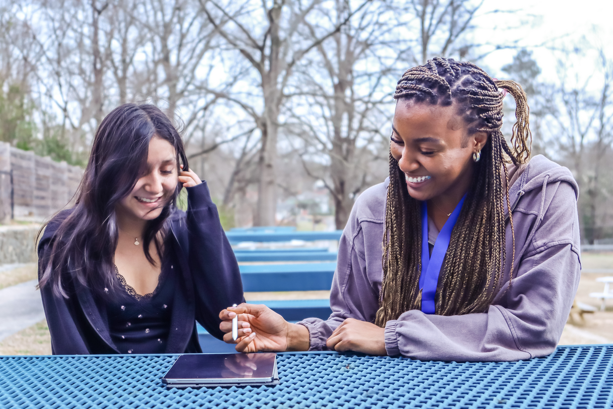 Two individuals collaborating