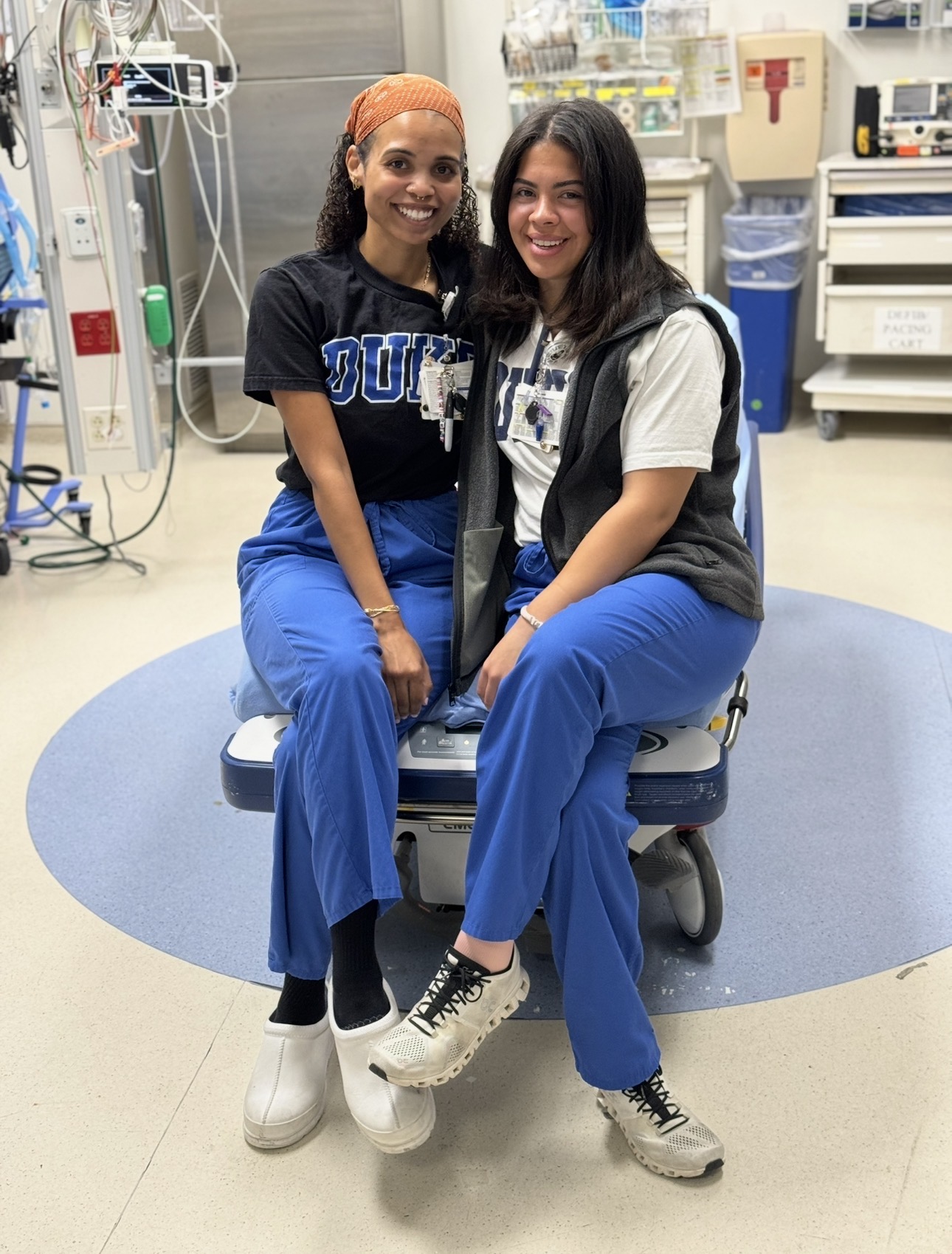 Two nurses sitting side by side