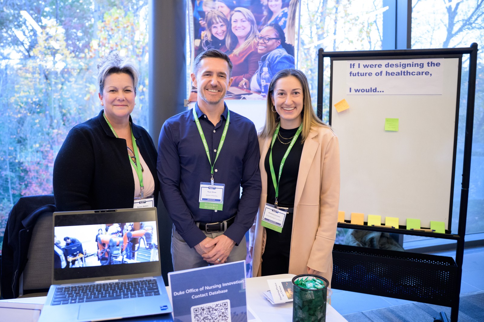 Doreen Matters, Ryan Shaw, and Kimberly Coston in front of a white board with post-it notes on it