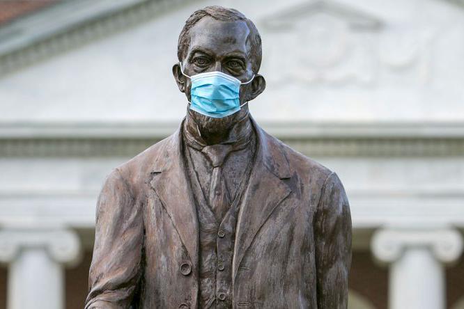 Statue wearing COVID mask