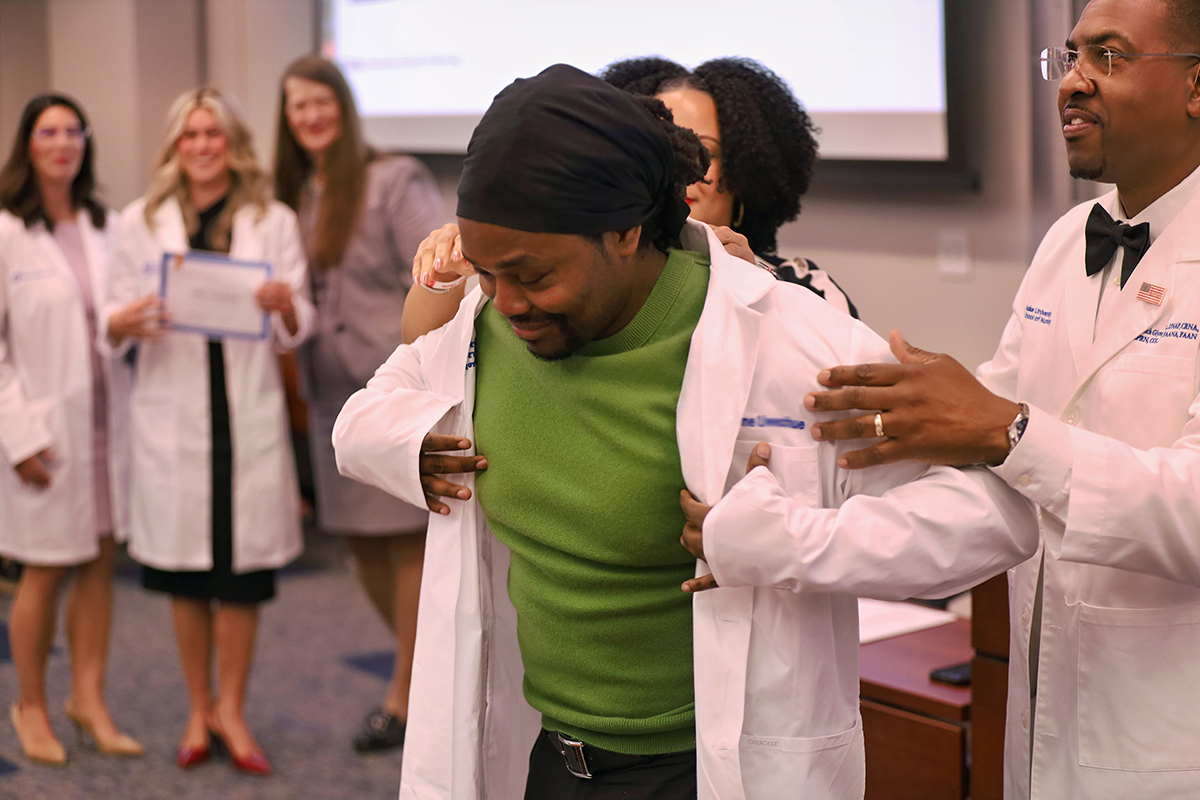 CRNA Student receiving his white coat