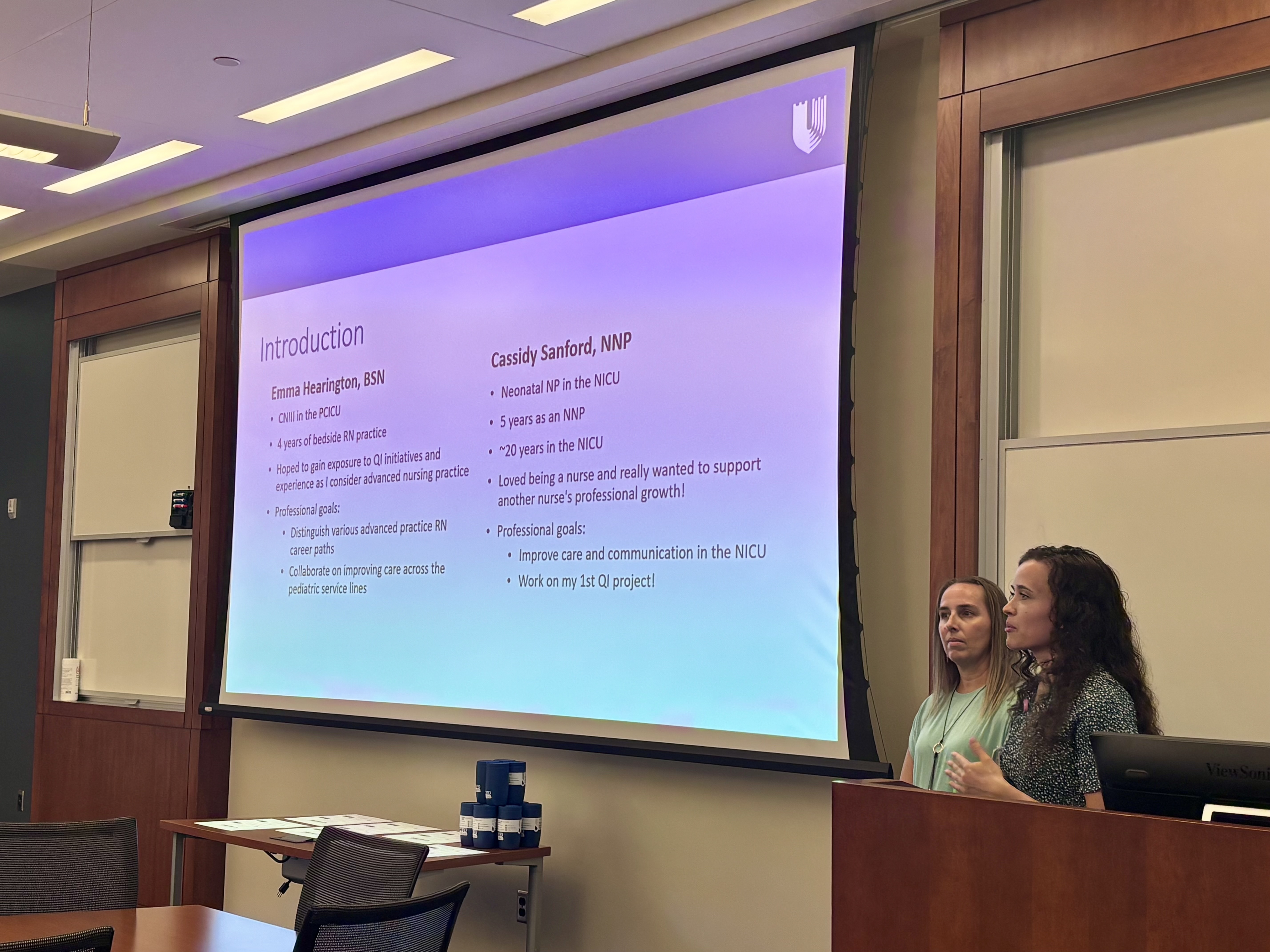 Two program participants delivering a presentation