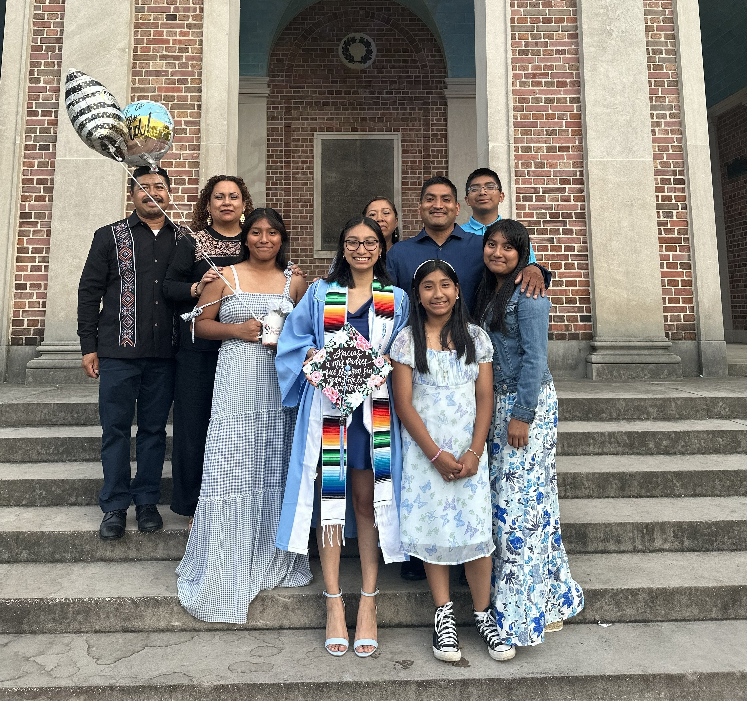 Ramirez Martinez surrounded by her family at her college graduation