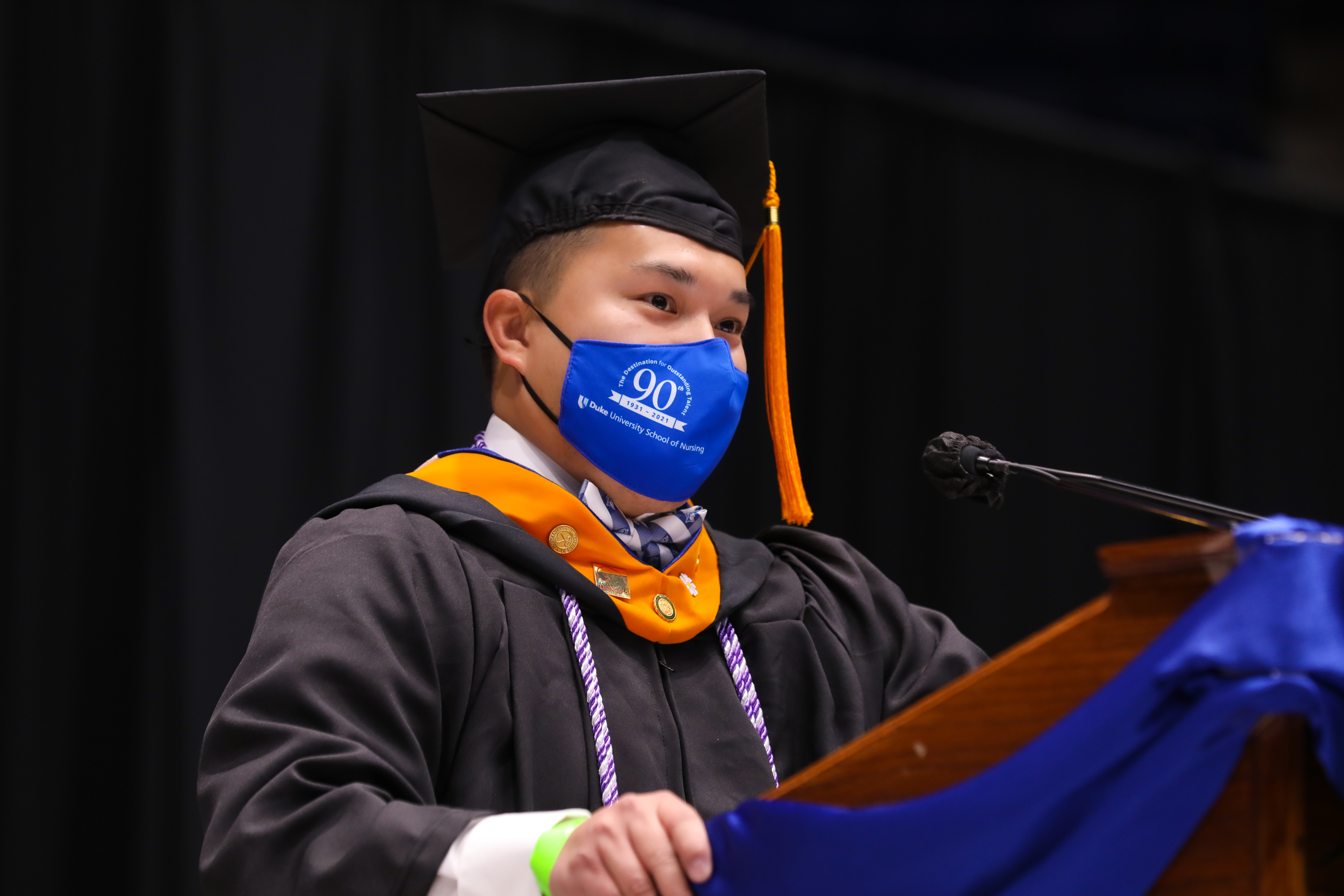 Male graduate speaking at graduation