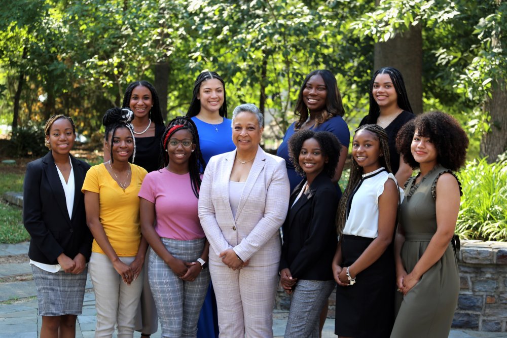 group photo outside duke school of nursing building with Brigit Carter, Laila Jones, Tara Brooks-Griffin, Briyonne Grooms, Asia Brown, Kersten Pierre, Gizelle Harris, Amanda Drummer, Cameron Fitzpatrick, London Hicks, and Lanay Fuller  