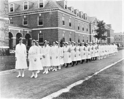 black and white photo of first class of female students