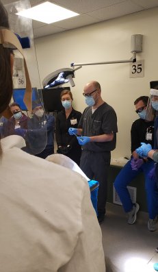 male doctor showing process to students