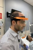General surgeon testing face shield in simulation