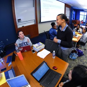 PhD student talking with ABSN students