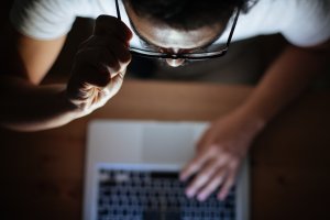 Man looking on computer