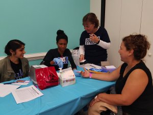 Students providing care at community health event