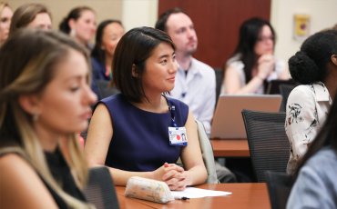 Duke School of Nursing Students sit in a classroom eagerly watching a presentation