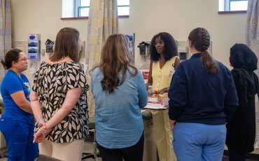 Faculty and Students in a discussion
