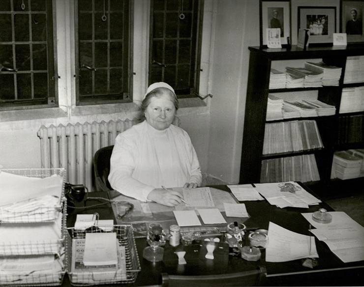 Bessie Baker at her Desk