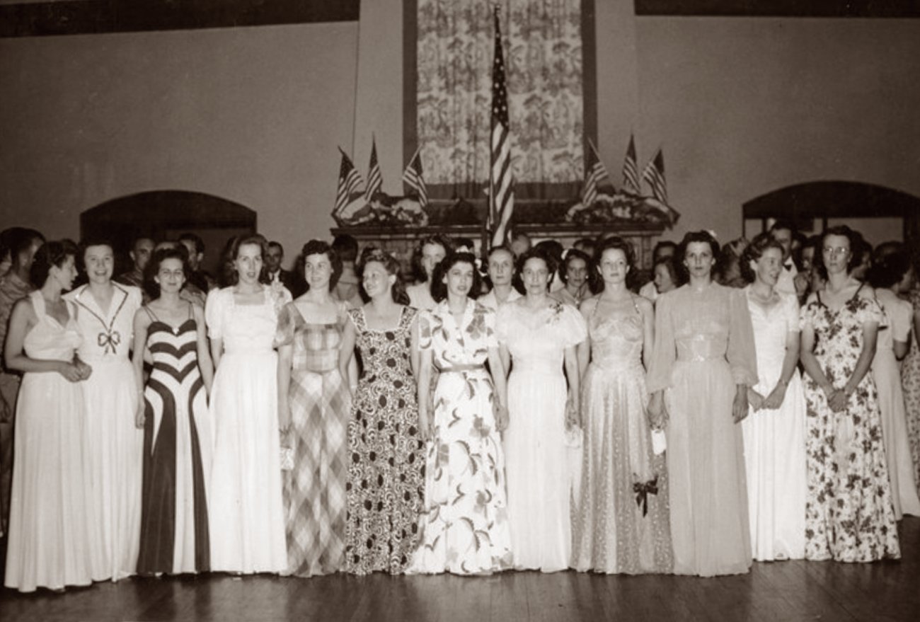 Nurses at a flag presentation at a party for members of the 65th General Hospital