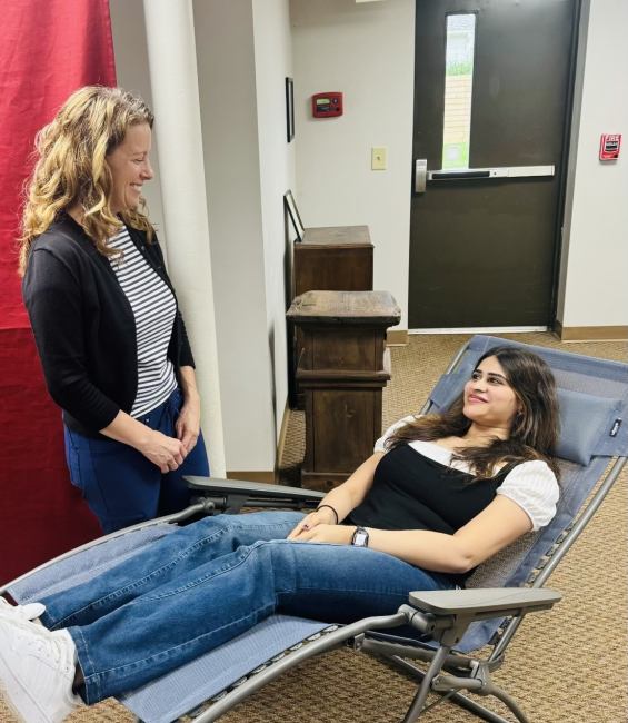 Acupuncturist Michelle Mill with study coordinator Akshita Movva, who is filling in for a patient.