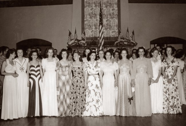 Nurses at a flag presentation at a party for members of the 65th General Hospital