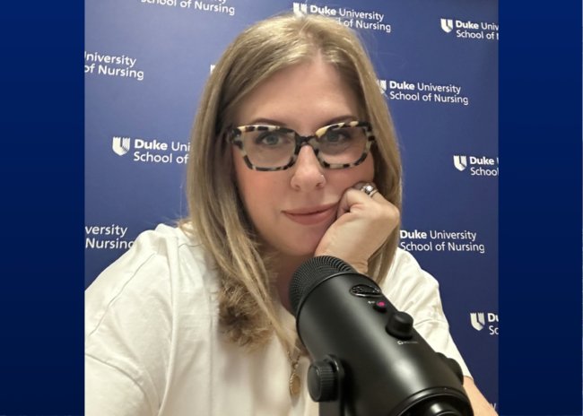 Jill Sergison in front of microphone