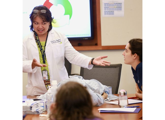 Nurse teaching in classroom
