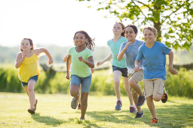 Children running in a field