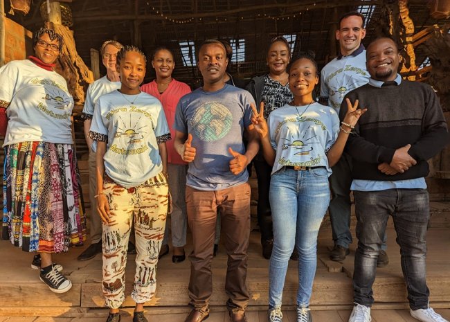 Smiling people posing for a group photo