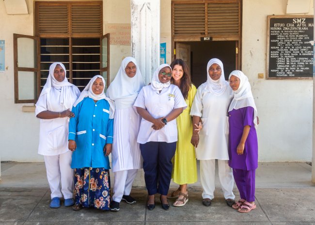 Women standing together outside of a clinic