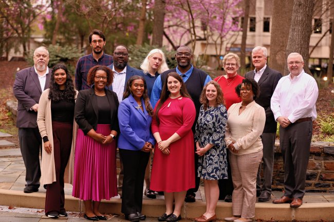The cohort of the 2026 Staff Leadership Development Program cohort poses outside Pearson Building