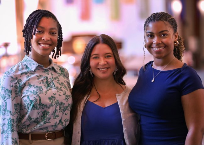 Three nurse scientist interns looking at the camera