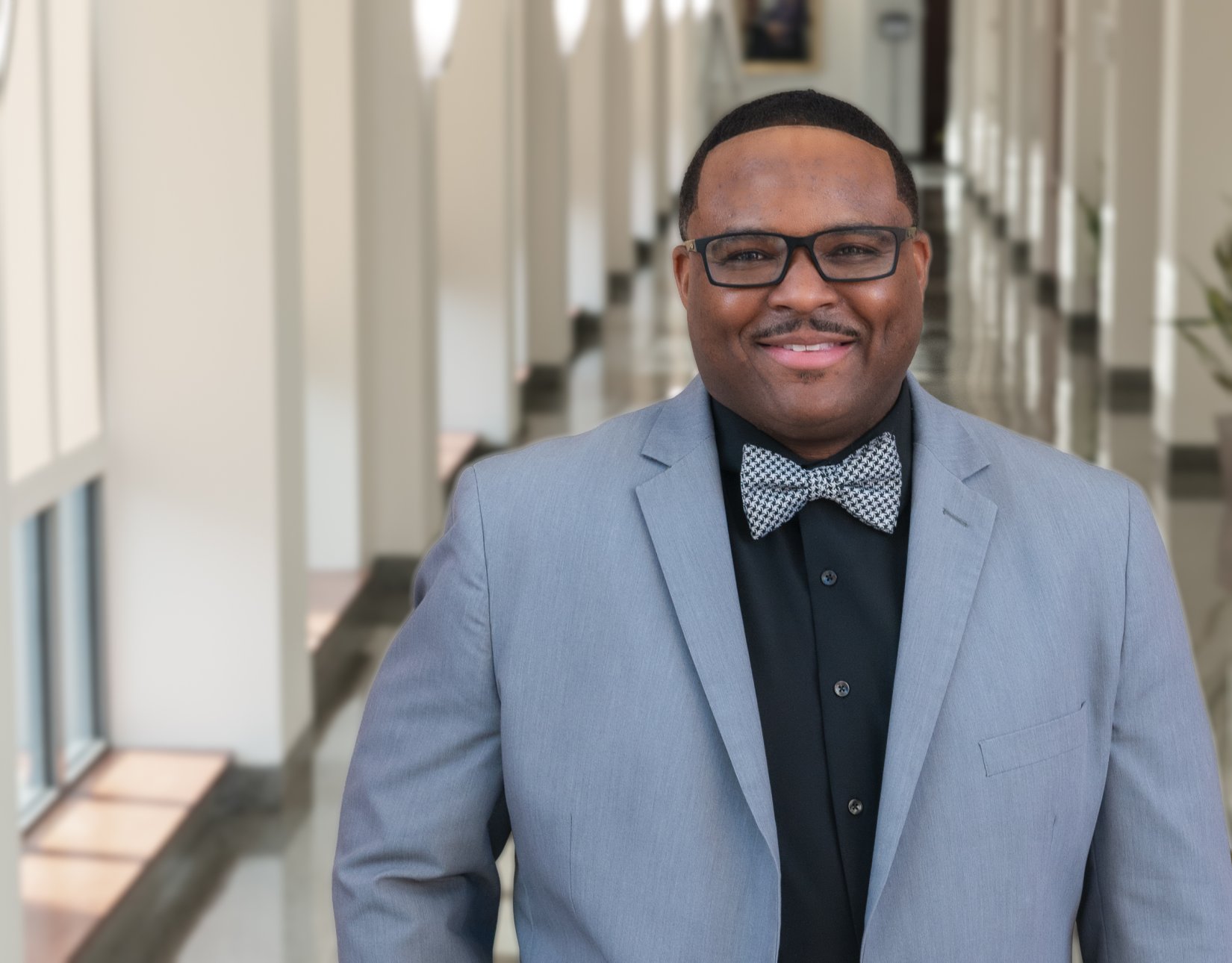 Michael Cary standing in Admissions hallway of Pearson Building