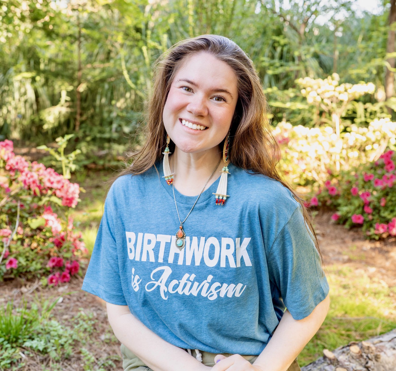 Reesa Artz wearing a t-shirt that says Birth Work is Activism