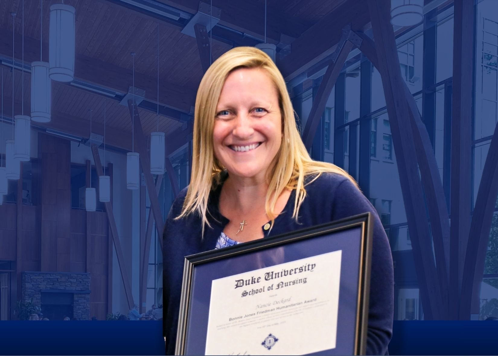 Nancie Deckard holding an award